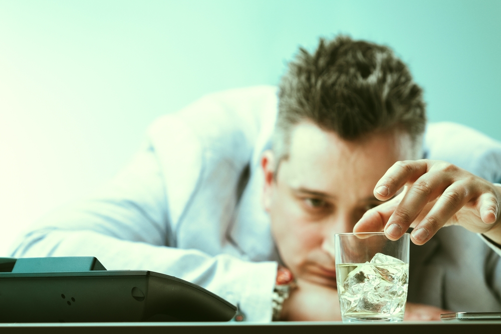 Overwhelmed,By,Stress,,A,Man,Resorts,To,Drinking,At,Work,
